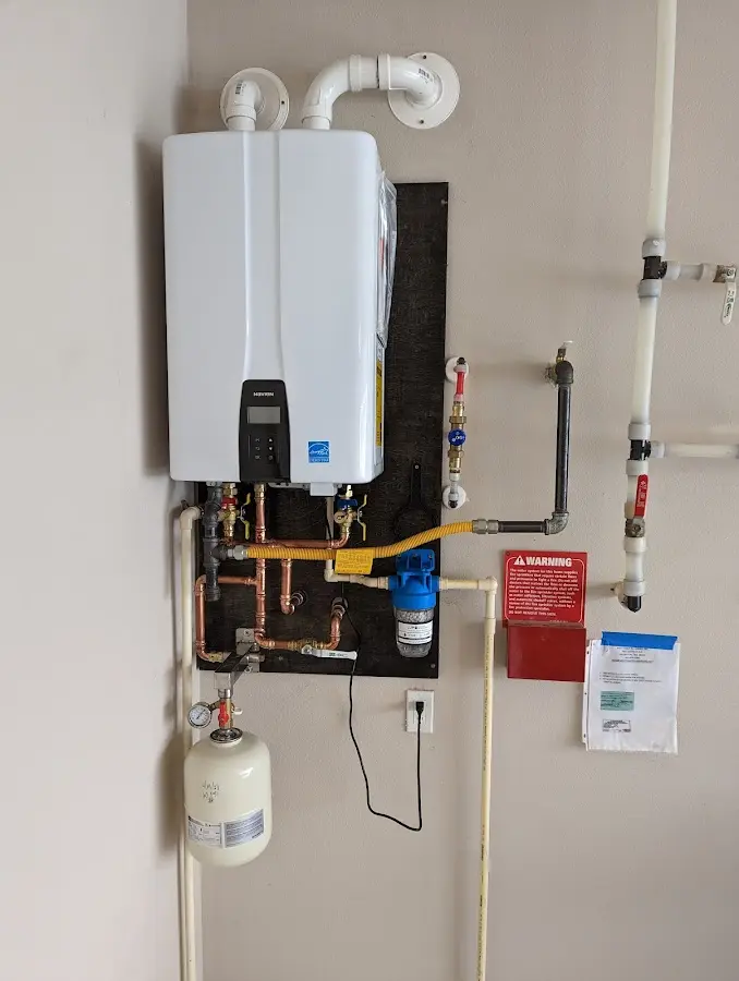 Professional plumber installing copper piping in a Santa Paula home